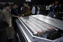People look at a model of CATLs Qilin Condensed Battery during the CATL Tech Day event ahead of the Beijing Auto Show in Beijing on April 21, 2026. (Photo by WANG Zhao / AFP)