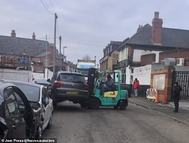 105277187-15439043-Footage_shows_the_forklift_operator_moving_the_vehicle_from_the_-m-105_1767713256831