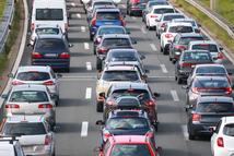 Rear view of traffic jam of lined up cars stuck on the highway toll.