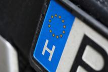 Close-up of car european license plate. Automobile from eu. Macro shot of registration number from european union. Small stars placed in circle. Vehicle and transport concept