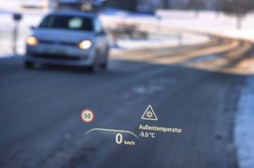 11 December 2022, Bavaria, Ruderatshofen: A head-up display on the windshield of a car indicates a danger of icy roads and a temperature of minus nine degrees Celsius. Photo: Karl-Josef Hildenbrand/dpa (Photo by Karl-Josef Hildenbrand/picture alliance via Getty Images)