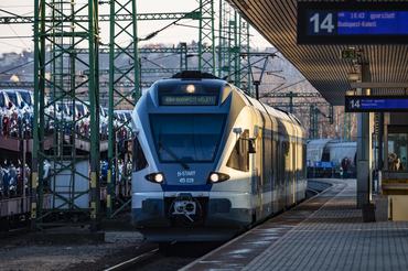 Budapest, Hungary - February 28, 2021: MAV Hungarian Railways passenger train with Stadler FLIRT 415 039 multiple unit trainset arrival at Budapest Kelenfold railway train station.