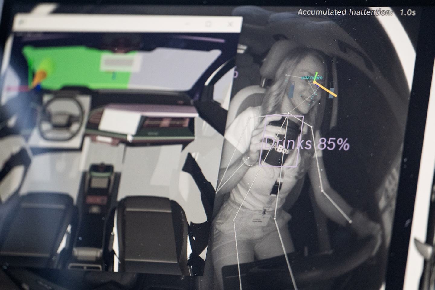 18 June 2024, Baden-Württemberg, Renningen: A demonstration display in a vehicle shows a Bosch associate holding a drink at the Bosch Tech Day 2024 at Robert Bosch GmbH. Bosch presented an interior sensing system designed to increase safety and comfort. The interior of the vehicle is recorded in order to detect, for example, fatigue and distraction of the occupants. Photo: Marijan Murat/dpa (Photo by Marijan Murat/picture alliance via Getty Images)