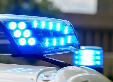 06 August 2025, Berlin: A flashing blue light on a police vehicle lights up during an inspection by the customs financial control unit for illegal employment at a construction site. Photo: Soeren Stache/dpa (Photo by Soeren Stache/picture alliance via Getty Images)