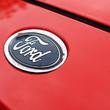 VILSHOFEN ON THE DANUBE, BAVARIA, GERMANY - 2025/09/25: A vibrant image focusing on the classic blue oval Ford logo. The emblem is mounted on a bright red car body, creating a strong color contrast. The logo is clean and clear, and the surrounding paint is smooth and shiny. The overall impression is one of crisp detail and strong visual appeal. (Photo Illustration by Igor Golovniov/SOPA Images/LightRocket via Getty Images)