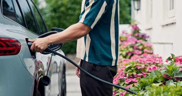 Petrol, hand sand man with car, fuel and travel with transportation cost for clean energy. Driver, vehicle maintenance and person with diesel pump, quality service and automobile with sustainability