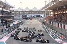 F1 cars lined up at the start of the race on track with Max Verstappen of Red Bull Racing leading, with Lando Norris and Oscar Piastri of McLaren following, during the 2025 ETIHAD Airways Abu Dhabi F1 Grand Prix at Yas Marina Circuit, United Arab Emirates on December 7, 2025 (Photo by Nicolas Economou/NurPhoto via Getty Images)