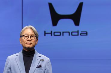 TOKYO, JAPAN - JANUARY 20: Honda Motor Co. CEO Toshihiro Mibe poses for photographs during Honda x Aston Martin Aramco Formula One team launch on January 20, 2026 in Tokyo, Japan. (Photo by Takashi Aoyama/Getty Images)