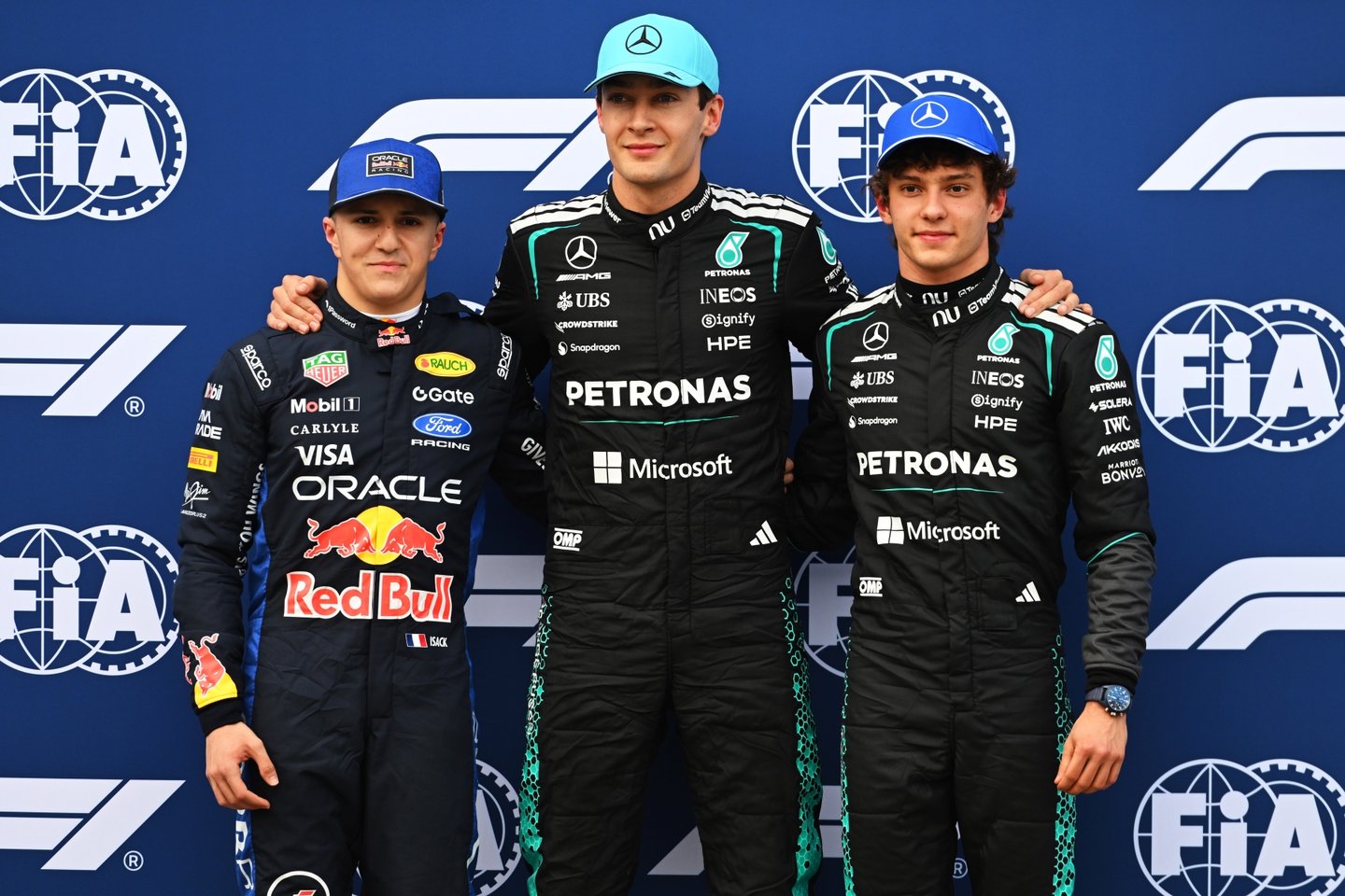 MELBOURNE, AUSTRALIA - MARCH 07: Pole position qualifier George Russell of Great Britain and Mercedes AMG Petronas F1 Team Second placed qualifier Andrea Kimi Antonelli of Italy and Mercedes AMG Petronas F1 Team and Third placed qualifier Isack Hadjar of France and Oracle Red Bull Racing look on during qualifying ahead of the F1 Grand Prix of Australia at Albert Park Grand Prix Circuit on March 07, 2026 in Melbourne, Australia. (Photo by Rudy Carezzevoli/Getty Images)