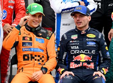 MELBOURNE, AUSTRALIA - MARCH 08: Oscar Piastri of Australia and McLaren and Max Verstappen of the Netherlands and Oracle Red Bull Racing talk on the drivers parade prior to the F1 Grand Prix of Australia at Albert Park Grand Prix Circuit on March 08, 2026 in Melbourne, Australia. (Photo by Mark Sutton - Formula 1/Formula 1 via Getty Images)