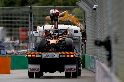 MELBOURNE, AUSTRALIA - MARCH 08: The crashed car of Oscar Piastri of Australia driving the (81) McLaren MCL40 Mercedes is cleared by the marshals during the F1 Grand Prix of Australia at Albert Park Grand Prix Circuit on March 08, 2026 in Melbourne, Australia. (Photo by Dom Gibbons - Formula 1/Formula 1 via Getty Images)