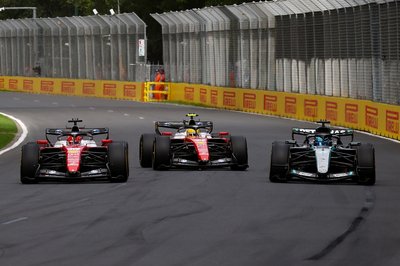 MELBOURNE, AUSTRALIA - MARCH 08: Charles Leclerc of Monaco driving the (16) Scuderia Ferrari SF-26 Lewis Hamilton of Great Britain driving the (44) Scuderia Ferrari SF-26 and George Russell of Great Britain driving the (63) Mercedes AMG Petronas F1 Team W17 battle for the lead during the F1 Grand Prix of Australia at Albert Park Grand Prix Circuit on March 08, 2026 in Melbourne, Australia. (Photo by Joe Portlock/Getty Images)