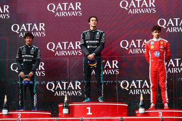 MELBOURNE, AUSTRALIA - MARCH 08: Race winner George Russell of Great Britain and Mercedes AMG Petronas F1 Team Second placed Andrea Kimi Antonelli of Italy and Mercedes AMG Petronas F1 Team and Third placed Charles Leclerc of Monaco and Scuderia Ferrari on the podium during the F1 Grand Prix of Australia at Albert Park Grand Prix Circuit on March 08, 2026 in Melbourne, Australia. (Photo by Joe Portlock/Getty Images)