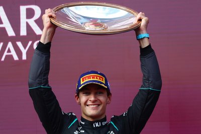MELBOURNE, AUSTRALIA - MARCH 08: Race winner George Russell of Great Britain and Mercedes AMG Petronas F1 Team lifts his trophy on the podium during the F1 Grand Prix of Australia at Albert Park Grand Prix Circuit on March 08, 2026 in Melbourne, Australia. (Photo by Joe Portlock/Getty Images)