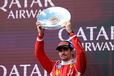 MELBOURNE, AUSTRALIA - MARCH 08: Third placed Charles Leclerc of Monaco and Scuderia Ferrari lifts his trophy on the podium during the F1 Grand Prix of Australia at Albert Park Grand Prix Circuit on March 08, 2026 in Melbourne, Australia. (Photo by Anni Graf - Formula 1/Formula 1 via Getty Images)
