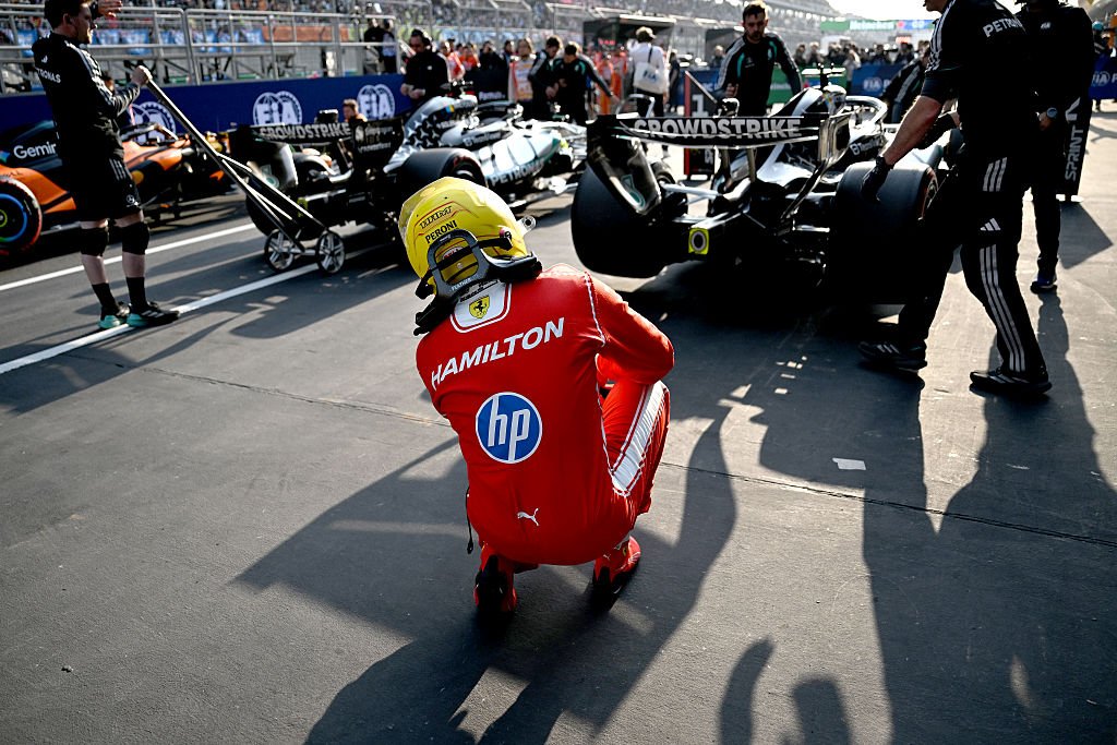 SHANGHAI, CHINA - MARCH 13: Fourth placed qualifier Lewis Hamilton of Great Britain and Scuderia Ferrari looks at the Mercedes AMG Petronas F1 Team car in parc ferme during Sprint qualifying ahead of the F1 Grand Prix of China at Shanghai International Circuit on March 13, 2026 in Shanghai, China. (Photo by Mark Sutton - Formula 1/Formula 1 via Getty Images)