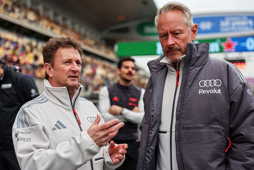 SHANGHAI, CHINA - MARCH 15: Allan McNish, Driver Development Programme Director of Audi F1 Team and Jonathan Wheatley, Team Principal of Audi F1 Team talk on the grid during F1 Academy Round 1, race 2 at Shanghai International Circuit on March 15, 2026 in Shanghai, China. (Photo by Andy Hone/LAT Images)
