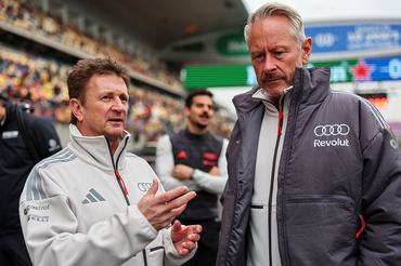 SHANGHAI, CHINA - MARCH 15: Allan McNish, Driver Development Programme Director of Audi F1 Team and Jonathan Wheatley, Team Principal of Audi F1 Team talk on the grid during F1 Academy Round 1, race 2 at Shanghai International Circuit on March 15, 2026 in Shanghai, China. (Photo by Andy Hone/LAT Images)