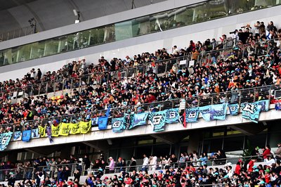 SHANGHAI, CHINA - MARCH 15: Fans of George Russell of Great Britain and Mercedes AMG Petronas F1 Team at the drivers parade prior to the F1 Grand Prix of China at Shanghai International Circuit on March 15, 2026 in Shanghai, China. (Photo by Mark Sutton - Formula 1/Formula 1 via Getty Images)