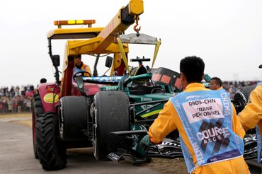 SHANGHAI, CHINA - MARCH 15: Marshals remove the car of Lance Stroll of Canada and Aston Martin F1 Team from the circuit during the F1 Grand Prix of China at Shanghai International Circuit on March 15, 2026 in Shanghai, China. (Photo by Alex Bierens de Haan/Getty Images)