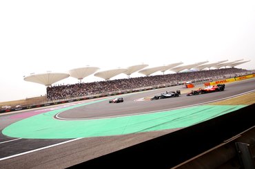 SHANGHAI, CHINA - MARCH 15: George Russell of Great Britain driving the (63) Mercedes AMG Petronas F1 Team W17 leads Lewis Hamilton of Great Britain driving the (44) Scuderia Ferrari SF-26 on track during the F1 Grand Prix of China at Shanghai International Circuit on March 15, 2026 in Shanghai, China. (Photo by Sona Maleterova/Getty Images)