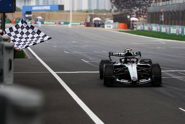 SHANGHAI, CHINA - MARCH 15: Race winner Andrea Kimi Antonelli of Italy driving the (12) Mercedes AMG Petronas F1 Team W17 takes the chequered flag during the F1 Grand Prix of China at Shanghai International Circuit on March 15, 2026 in Shanghai, China. (Photo by Mark Thompson/Getty Images)