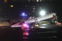 NEW YORK, UNITED STATES - MARCH 23: Passenger plane collides with a fire truck while landing at LaGuardia Airport, killing the pilot and copilot and injuring two others on March 23, 2026, in New York, United States. (Photo by Selcuk Acar/Anadolu via Getty Images)