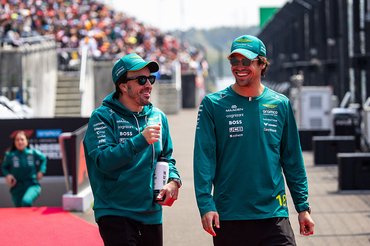 SUZUKA, JAPAN - MARCH 29: Lance Stroll of Canada and Aston Martin F1 Team and Fernando Alonso of Spain and Aston Martin F1 Team walk to the grid for the drivers' parade during the F1 Grand Prix of Japan at Suzuka Circuit on March 29, 2026 in Suzuka, Japan. (Photo by Jayce Illman/Getty Images)
