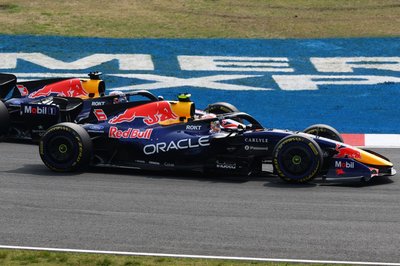 SUZUKA, JAPAN - MARCH 29: Max Verstappen of the Netherlands driving the (3) Oracle Red Bull Racing RB22 Red Bull Ford and Isack Hadjar of France driving the (6) Oracle Red Bull Racing RB22 Red Bull Ford battle for track position during the F1 Grand Prix of Japan at Suzuka Circuit on March 29, 2026 in Suzuka, Japan. (Photo by Clive Mason/Getty Images)
