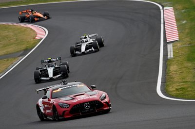 SUZUKA, JAPAN - MARCH 29: The FIA Safety Car leads Andrea Kimi Antonelli of Italy driving the (12) Mercedes AMG Petronas F1 Team W17 and Valtteri Bottas of Finland driving the (77) Cadillac F1 Team MAC-26 Ferrari on track during the F1 Grand Prix of Japan at Suzuka Circuit on March 29, 2026 in Suzuka, Japan. (Photo by Rudy Carezzevoli/Getty Images)