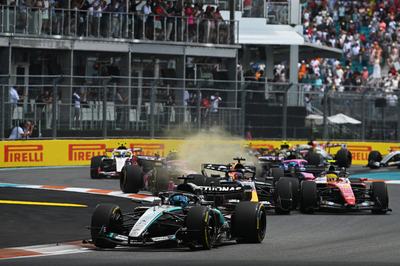 MIAMI, FLORIDA - MAY 02: George Russell of Great Britain driving the (63) Mercedes AMG Petronas F1 Team W17 leads Max Verstappen of the Netherlands driving the (3) Oracle Red Bull Racing RB22 Red Bull Ford and Lewis Hamilton of Great Britain driving the (44) Scuderia Ferrari SF-26 at the start during the Sprint ahead of the F1 Grand Prix of Miami at Miami International Autodrome on May 02, 2026 in Miami, Florida. (Photo by Rudy Carezzevoli/Getty Images)