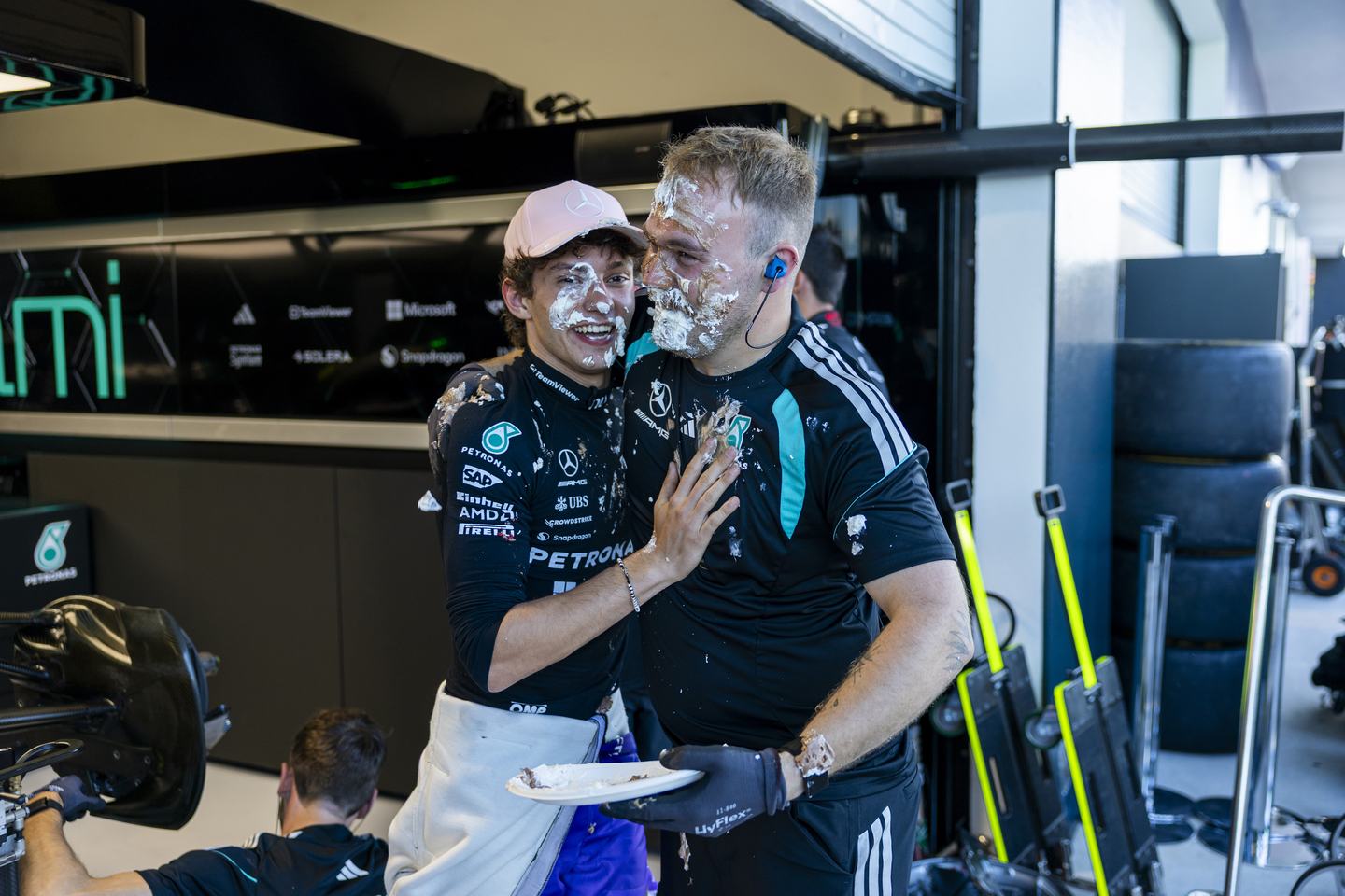MIAMI, FLORIDA - MAY 02: Pole position qualifier Andrea Kimi Antonelli of Italy and Mercedes AMG Petronas F1 Team celebrates with his team during qualifying ahead of the F1 Grand Prix of Miami at Miami International Autodrome on May 02, 2026 in Miami, Florida. (Photo by Sam Bloxham/LAT Images)