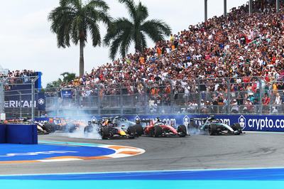 MIAMI, FLORIDA - MAY 03: Max Verstappen of the Netherlands driving the (3) Oracle Red Bull Racing RB22 Red Bull Ford Charles Leclerc of Monaco driving the (16) Scuderia Ferrari SF-26 and Andrea Kimi Antonelli of Italy driving the (12) Mercedes AMG Petronas F1 Team W17 lead the field at the start during the F1 Grand Prix of Miami at Miami International Autodrome on May 03, 2026 in Miami, Florida. (Photo by Alastair Staley/LAT Images)