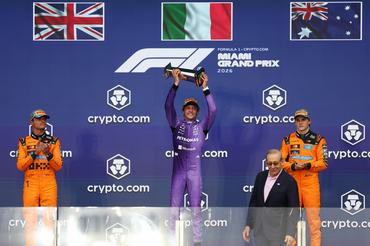 MIAMI, FLORIDA - MAY 03: Race winner Andrea Kimi Antonelli of Italy and Mercedes AMG Petronas F1 Team lifts his trophy on the podium during the F1 Grand Prix of Miami at Miami International Autodrome on May 03, 2026 in Miami, Florida. (Photo by Brett Farmer/LAT Images)