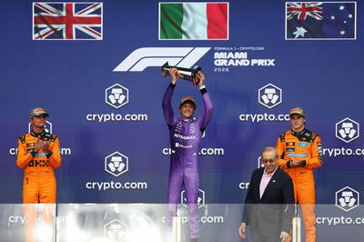 MIAMI, FLORIDA - MAY 03: Race winner Andrea Kimi Antonelli of Italy and Mercedes AMG Petronas F1 Team lifts his trophy on the podium during the F1 Grand Prix of Miami at Miami International Autodrome on May 03, 2026 in Miami, Florida. (Photo by Brett Farmer/LAT Images)