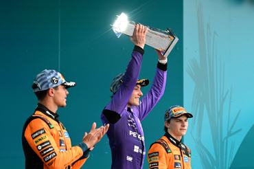MIAMI, FLORIDA - MAY 03: Race winner Andrea Kimi Antonelli of Italy and Mercedes AMG Petronas F1 Team lifts his trophy on the podium during the F1 Grand Prix of Miami at Miami International Autodrome on May 03, 2026 in Miami, Florida. (Photo by Mark Sutton - Formula 1/Formula 1 via Getty Images)