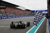MIAMI, FLORIDA - MAY 03: Rafael Nadal waves the chequered flag for Race winner Andrea Kimi Antonelli of Italy driving the (12) Mercedes AMG Petronas F1 Team W17 during the F1 Grand Prix of Miami at Miami International Autodrome on May 03, 2026 in Miami, Florida. (Photo by Mario Renzi - Formula 1/Formula 1 via Getty Images)