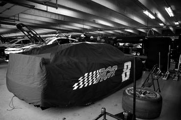 CONCORD, NORTH CAROLINA - MAY 23: (EDITOR'S NOTE: Image has been converted to black and white.) The #33 Cheddar's Scratch Kitchen Chevrolet, that will be driven by Austin Hill after the passing of Kyle Busch sits covered in the garage area prior to practice for the NASCAR Cup Series Coca-Cola 600 at Charlotte Motor Speedway on May 23, 2026 in Concord, North Carolina. (Photo by Jonathan Bachman/Getty Images)