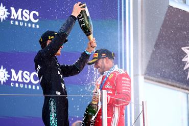 CIRCUIT DE CATALUNYA, BARCELONA, SPAIN - 2026/06/14: George Russell of Mercedes-AMG F1 Team (L) and Lewis Hamilton of Scuderia Ferrari HP (R) celebrate on the podium during the F1 Grand Prix of Catalunya . (Photo by Marco Canoniero/LightRocket via Getty Images)