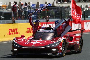 LE MANS, FRANCE - JUNE 14: The #7 Toyota Racing Toyota TR010 Hybrid driven by Kamui Kobayashi heads down the main grandstand straight with team mates Mike Conway (L) and Nyck de Vries (R) as they win the Le Mans 24 Hours at the Circuit de la Sarthe on June 14, 2026 in Le Mans, France. (Photo by Ker Robertson/Getty Images)
