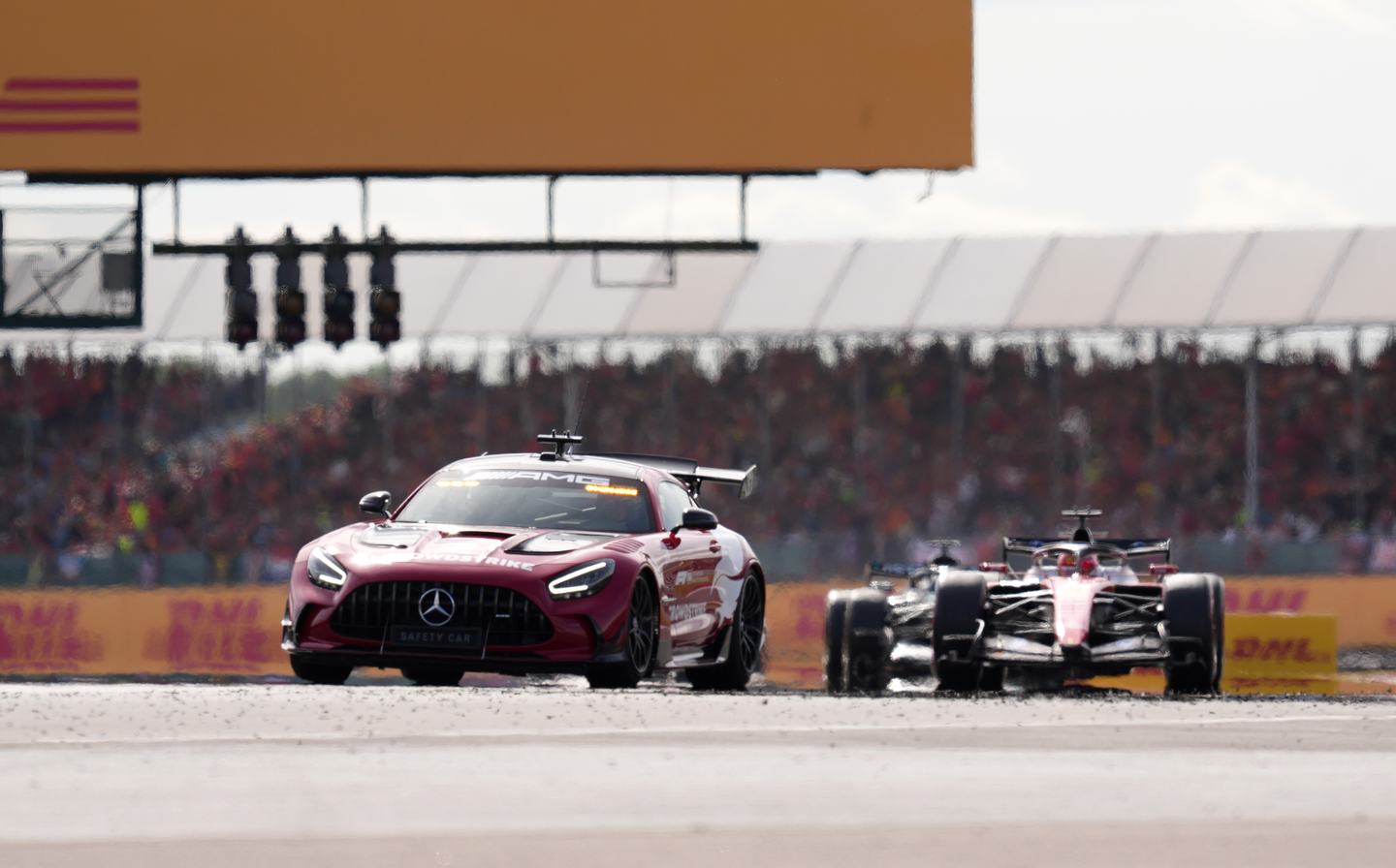 NORTHAMPTON, ENGLAND - JULY 05: The FIA Safety Car leads Charles Leclerc of Monaco driving the (16) Scuderia Ferrari SF-26 on track during the F1 Grand Prix of Great Britain at Silverstone Circuit on July 05, 2026 in Northampton, England. (Photo by Alex Caparros - Formula 1/Formula 1 via Getty Images)