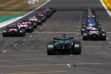 NORTHAMPTON, ENGLAND - JULY 05: Lance Stroll of Canada driving the (18) Aston Martin F1 Team AMR26 Honda takes his grid spot ready for the start during the F1 Grand Prix of Great Britain at Silverstone Circuit on July 05, 2026 in Northampton, England. (Photo by Bryn Lennon - Formula 1/Formula 1 via Getty Images)