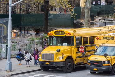 School buses line up in front of PS 33 in Chelsea in New York on Tuesday, December 15, 2015 for normal dismissal of the students. A bomb threat deemed to be a hoax was sent to the NY Dept. of Education and to the Los Angeles Unified School District. LA closed all of its schools effecting 640,000 students while NY kept the schools open with normal dismissal times. (�� Richard B. Levine) (Photo by Richard Levine/Corbis via Getty Images)