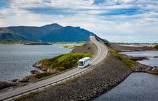 Tourist bus traveling on the road in Norway. Atlantic Ocean Road or the Atlantic Road (Atlanterhavsveien) been awarded the title as "Norwegian Construction of the Century".