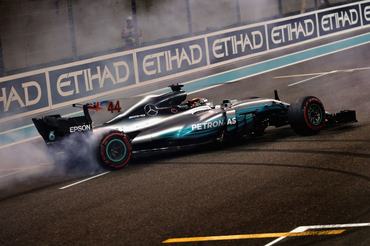 ABU DHABI, UNITED ARAB EMIRATES - NOVEMBER 26:  Second place finisher Lewis Hamilton of Great Britain and Mercedes GP celebrates with donuts on track during the Abu Dhabi Formula One Grand Prix at Yas Marina Circuit on November 26, 2017 in Abu Dhabi, United Arab Emirates.  (Photo by Mark Thompson/Getty Images)