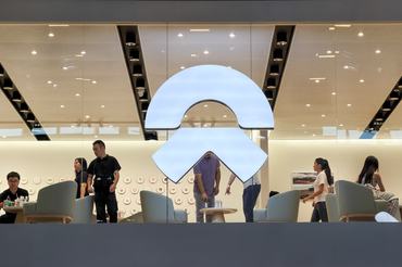 SHENZHEN, CHINA - JUNE 3: The illuminated Nio logo is displayed at an exhibition area during the 30th Guangdong-Hong Kong-Macao Greater Bay Area Auto Show on June 3, 2026, in Shenzhen, Guangdong Province, China. Nio is a Chinese electric vehicle manufacturer known for its premium smart electric vehicles and battery-swapping technology. Chinese automakers continued to promote new energy vehicle technologies and brand experiences as competition in the countryâs EV market intensifies. (Photo by Cheng Xin/Getty Images)